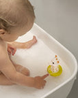 Sophie la Girafe Bath Toy - product shown in bathtub with baby