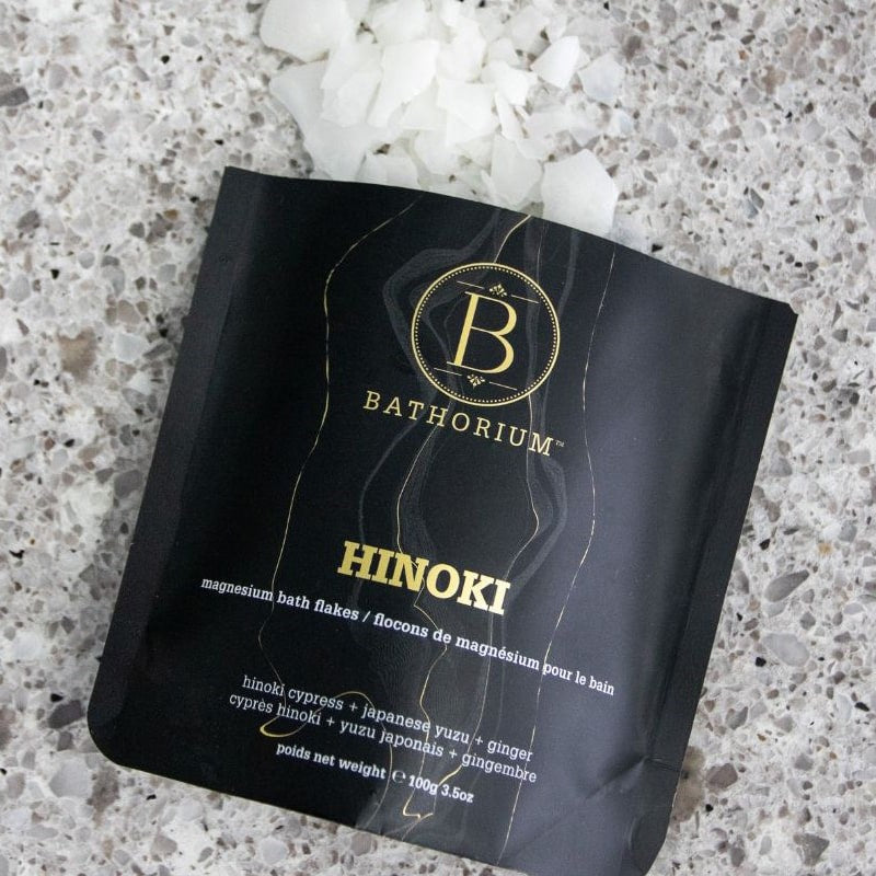 Bathorium Hinoki Magnesium Bath Flake Soak - product shown open with contents spilling out