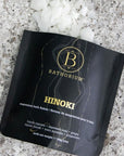 Bathorium Hinoki Magnesium Bath Flake Soak - product shown open with contents spilling out