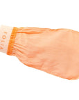 Folia Body Exfoliating Body Mitt - model using product on hand