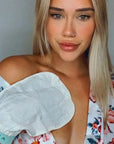 Folia Body Exfoliating Tan Removal Mitt - model shown wearing product