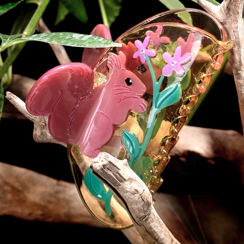 Winona Irene Wild Violet Claw - product shown on branch with leaves