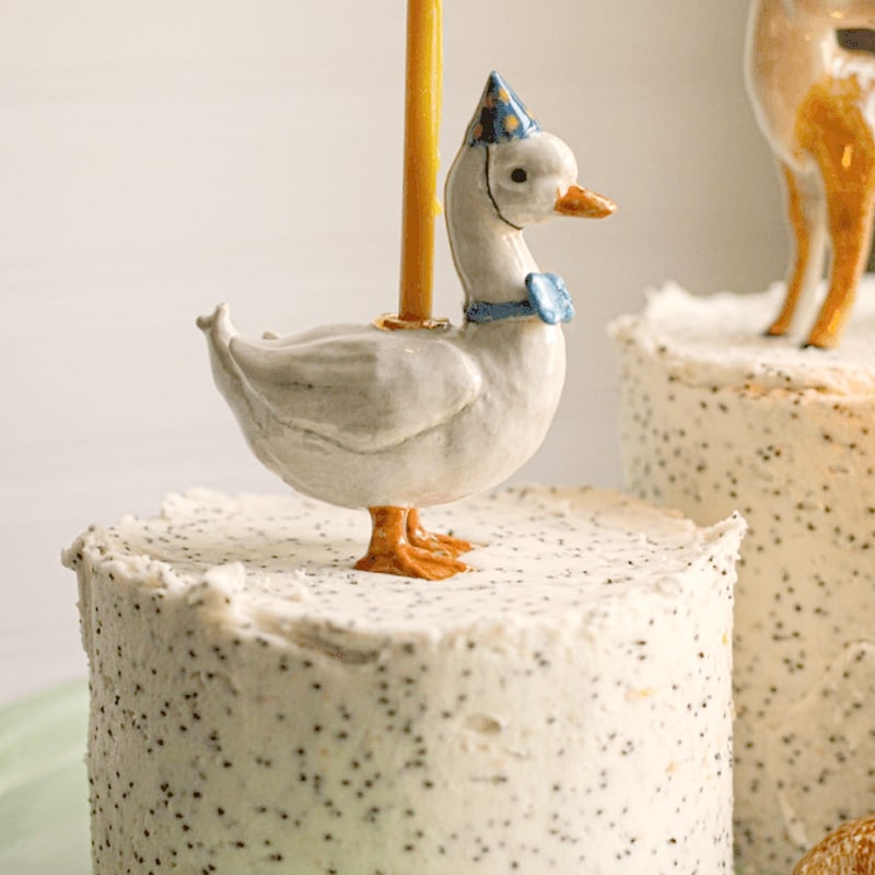 Camp Hollow Blue Goose Cake Topper - product shown on top of cake