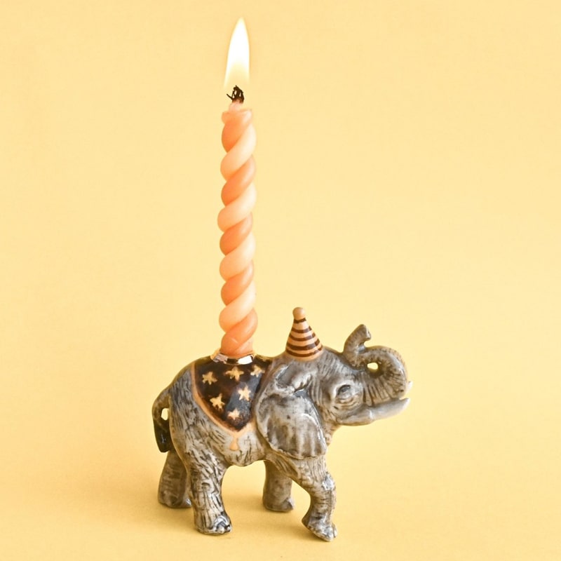 Camp Hollow Elephant Cake Topper - product shown with lit candle inside