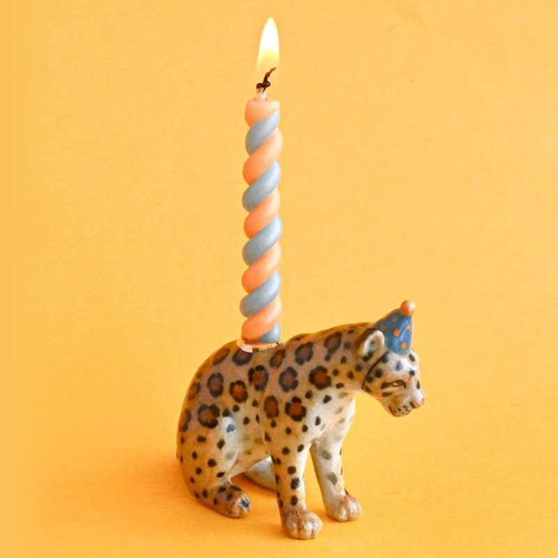 Camp Hollow Jaguar Cake Topper - product shown with lit candle inside