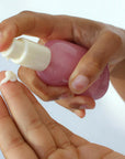 Foile Daily Jelly Moisturizer - model shown dispensing product onto hand