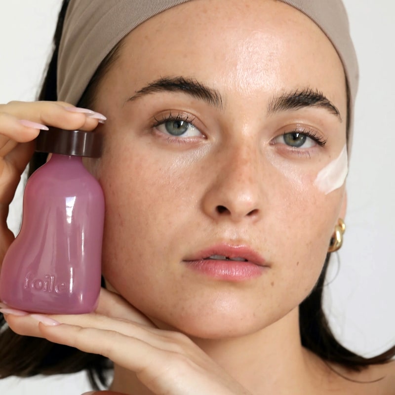 Foile Daily Jelly Moisturizer - model shown holding product close to face