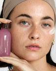 Foile Daily Jelly Moisturizer - model shown holding product close to face