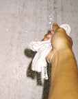 Foile Face Cloth - model shown holding product in shower