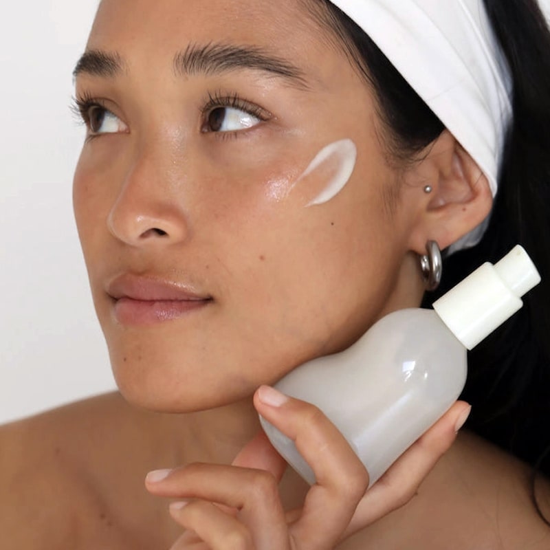 Foile Milky Emulsion Cleanser - model shown holding product