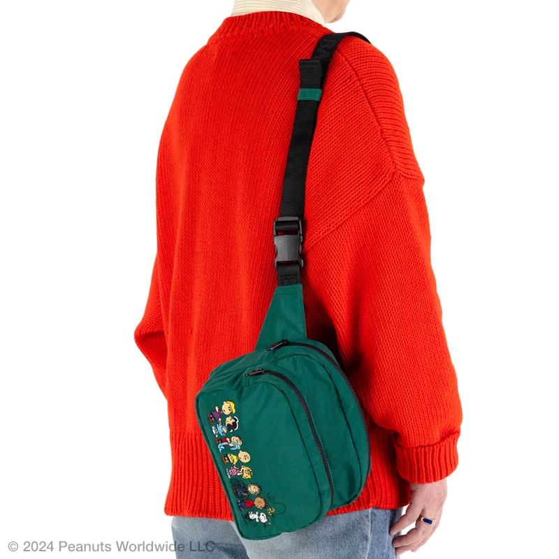 Baggu Fanny Pack - Peanuts - model shown with product hanging from shoulder