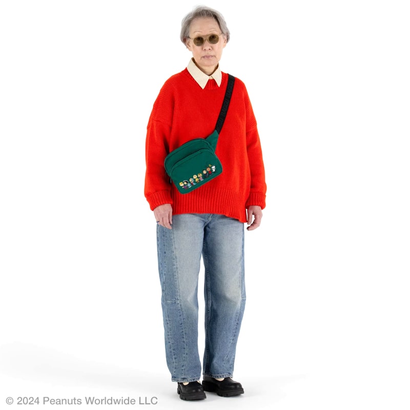 Baggu Fanny Pack - Peanuts - model shown with product around shoulder