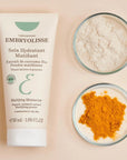 Embryolisse Mattifying Moisturizer - product shown next to two glass trays with ingredients on them