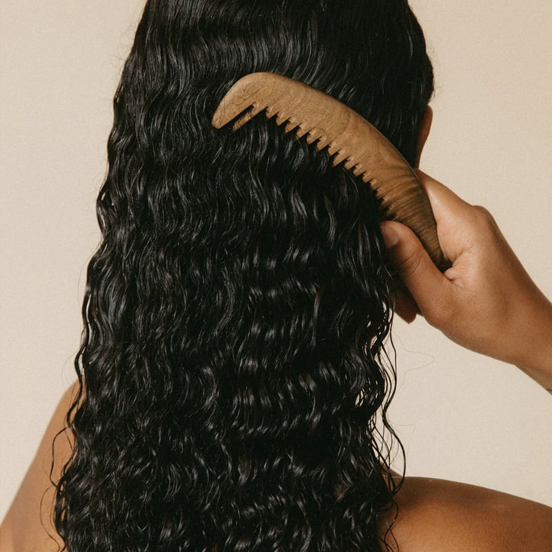 Roz Foundation Mask - model shown combing hair