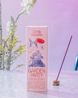 Oddly Specific Low Smoke Incense - Garden Party - product shown in front of plant and incense on wet table