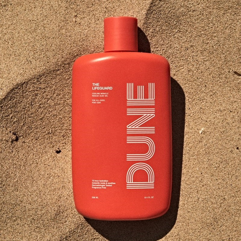 DUNE Suncare The Lifeguard - product shown on sand