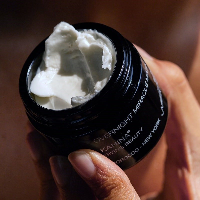 Kahina Giving Beauty Overnight Miracle Mask - model shown holding opened product showing texture and color