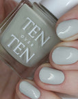 Tenoverten Nail Polish - Dover - model shown holding product and wearing color on nails