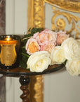 Trudon Tuileries Candle - product shown on table with flowers