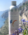 La Selva Positano Orange and Lavender Aromatherapy Cleanser - product shown on cliffside with flowers