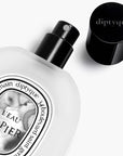 Diptyque L'Eau Papier Hair Mist - product next to product cap