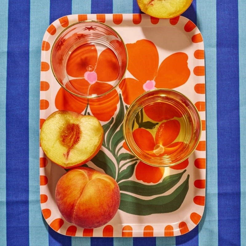 Lifestyle shot top view of One &amp; Only Paper Wild Flower Orange Bent Birch Serving Tray (1 pc) with peaches and drinks sitting on tray