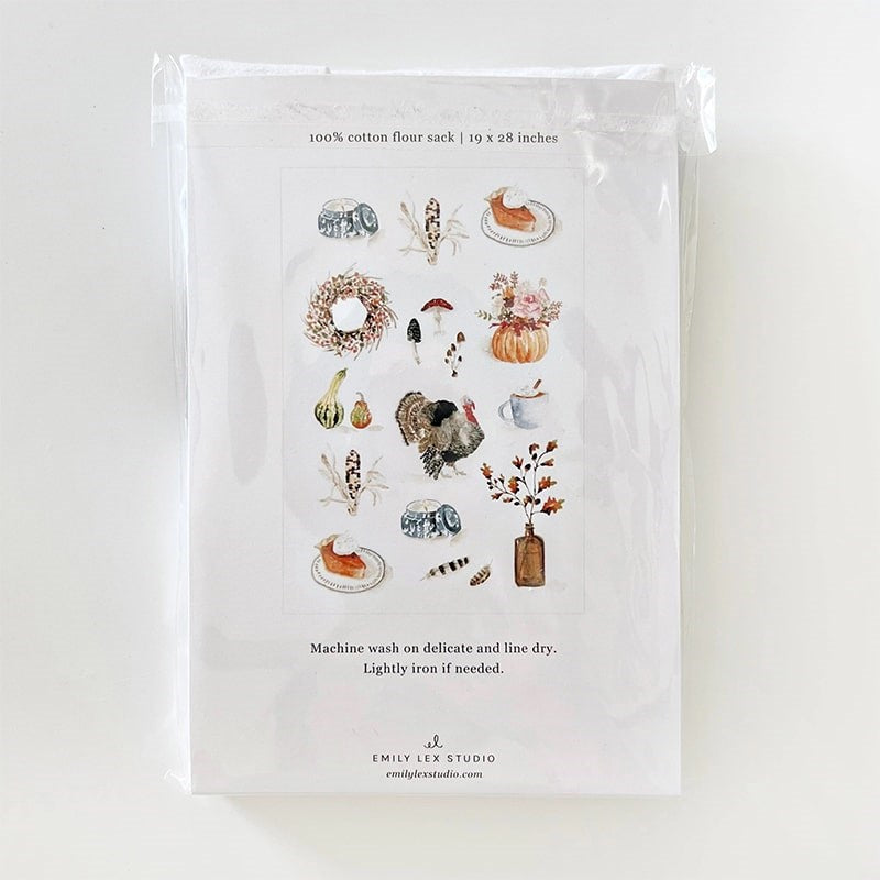 Emily Lex Studio Thanksgiving Tea Towel - backside of product shown in packaging