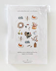 Emily Lex Studio Thanksgiving Tea Towel - backside of product shown in packaging