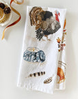 Emily Lex Studio Thanksgiving Tea Towel - product shown folded next to cleaning brush and ribbon