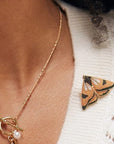 Fable England Enamel Moth Brooch - model shown wearing product on shirt