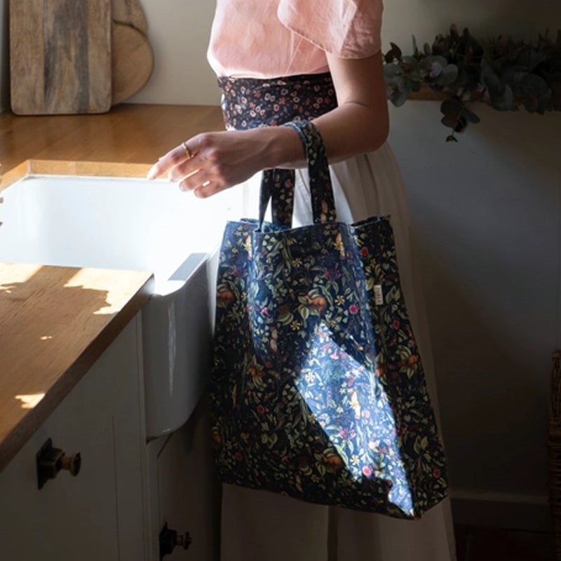 Fable England Wolf Garden Shopping Tote - model shown holding product in kitchen