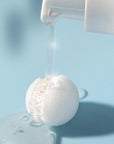 Snow Fox Skincare Ceramide & EGF Treatment Orb - product shown with serum dripping on it