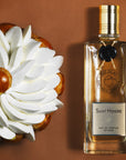 Parfums de Nicolai Saint Honore Intense Eau de Parfum - product shown next to pastry