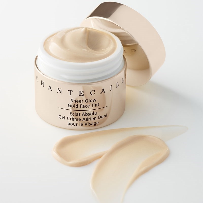 Chantecaille Sheer Glow Gold Face Tint - product shown with cap off next to product smear