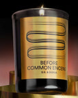 D.S. & Durga Before Common Encens Candle - product shown lit with gold ribbon