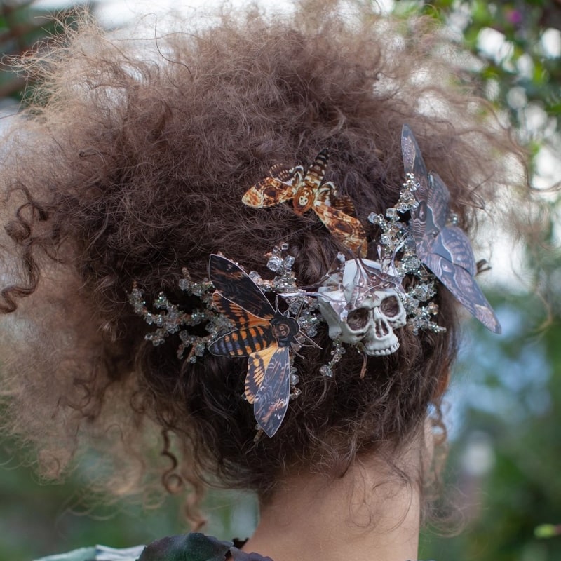 Model shown wearing moths in hair