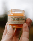 Smithereen Farm Bixa Fixa Healing Salve - model holding product