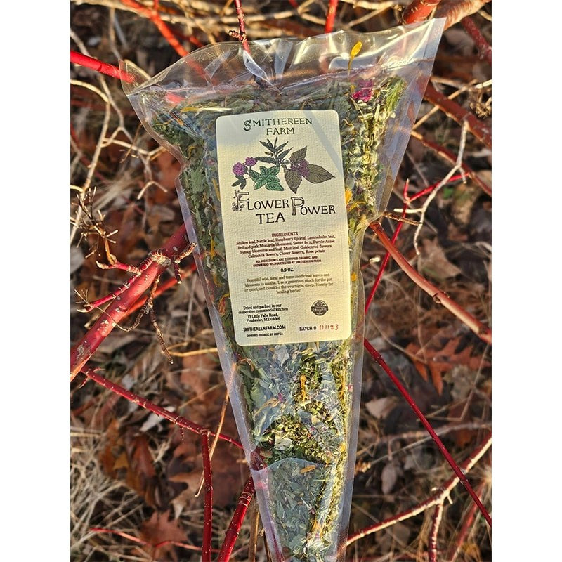 Smithereen Farm Flower Power Tea - product shown in packaging on top of branches