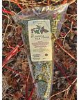 Smithereen Farm Flower Power Tea - product shown in packaging on top of branches