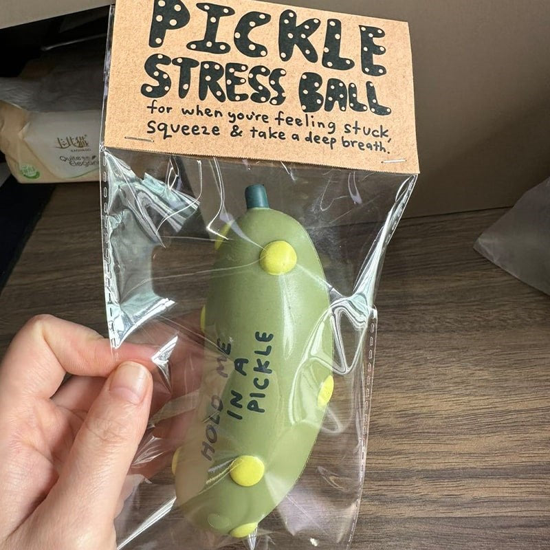 People I've Loved Pickle Stress Ball - model holding product inside packaging shown