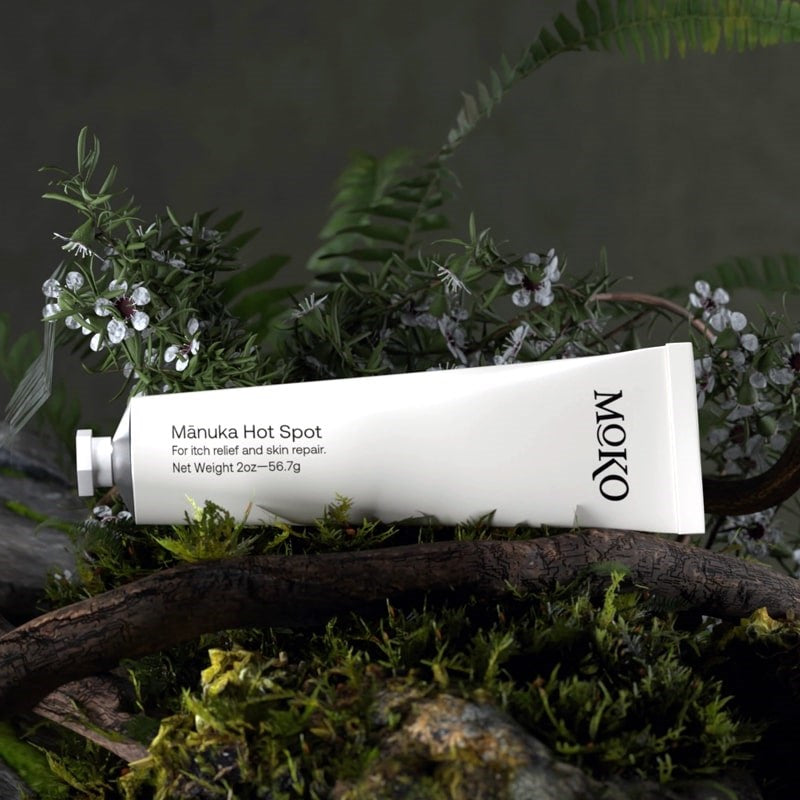 Moko Manuka Hot Spot - product shown on wood next to plants