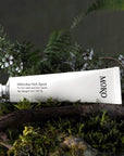 Moko Manuka Hot Spot - product shown on wood next to plants