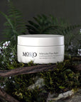 Moko Manuka Paw Balm - product shown on wood with flowers