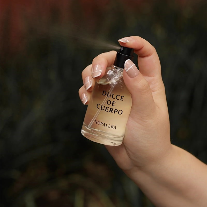 Nopalera Dulce de Cuerpo Eau de Parfum - model shown spraying product