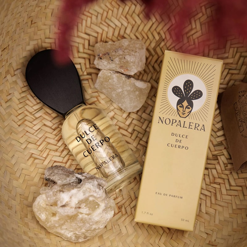 Nopalera Dulce de Cuerpo Eau de Parfum - product shown next to packaging and stones