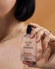 Nopalera Flor de Madera Eau de Parfum - model shown spraying product