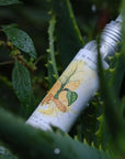 La Selva Positano Mint and Rosemary Massage Oil - product shown on plants