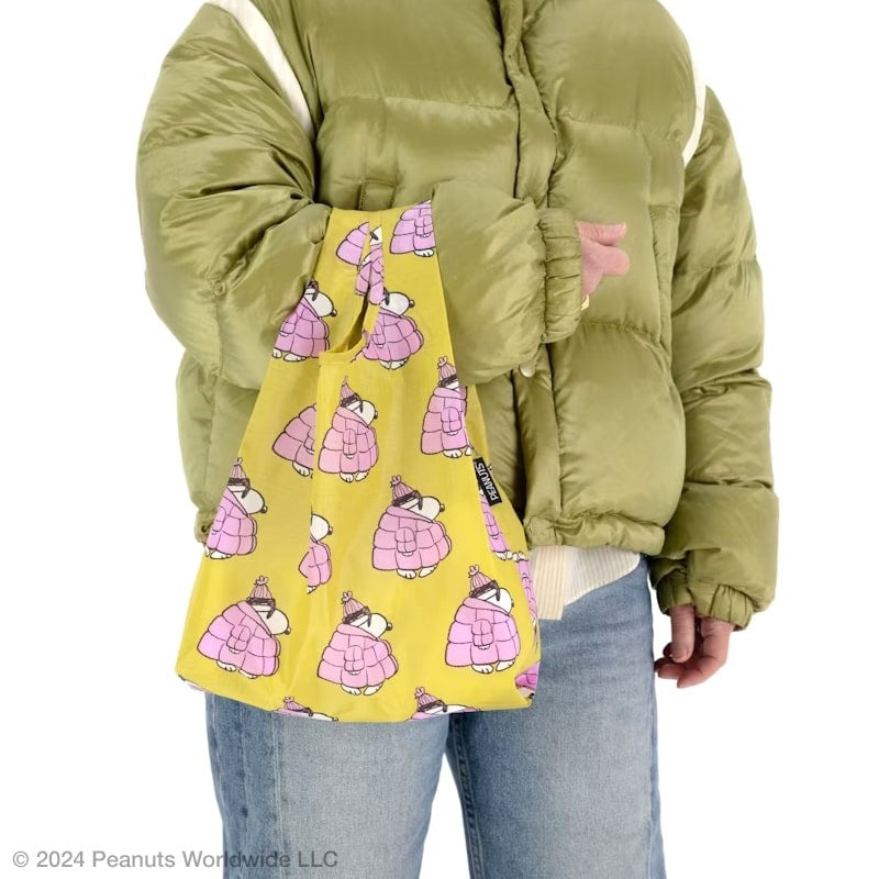 Close up of model holding Baggu Baby Baggu - Puffer Snoopy Pink (1 pc)