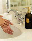 Lifestyle shot of model using Trudon Vixi Hand Soap (350 ml) at bathroom sink