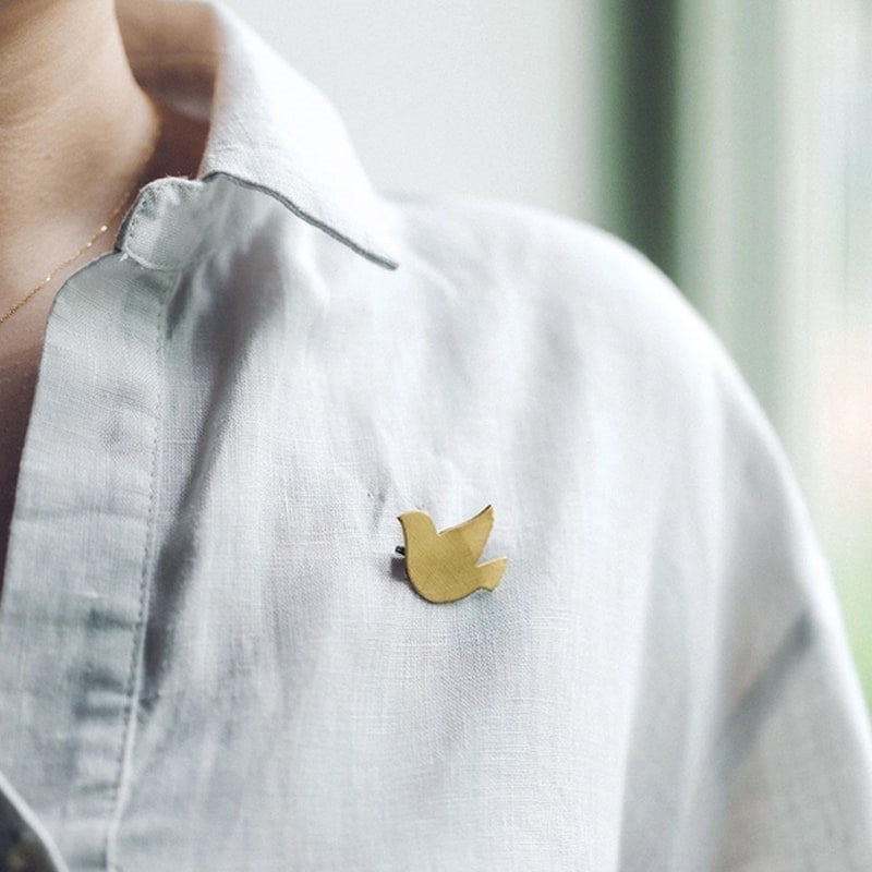 Fog Linen Work Bird Brass Brooch Cuckoo - model shown wearing product on shirt